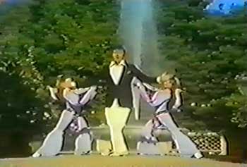 Bobby Van dances with a group of female dancers